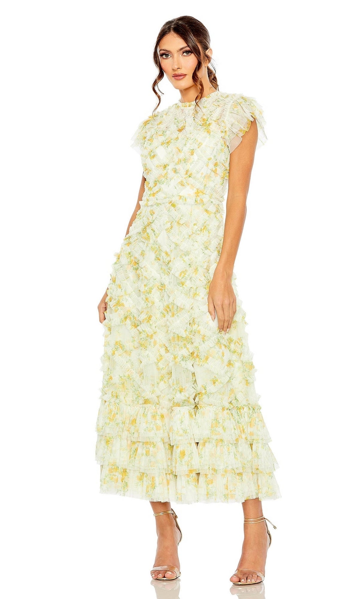 Woman wears the Knee Length Wedding Guest Dress 8009 by Mac Duggal, a pale yellow textured cap sleeve midi with layered ruffles and strappy heels—an elegant wedding guest look against a white background.